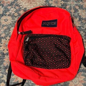 Jansport Bright Red Backpack with Black and Red Patterned Pocket
